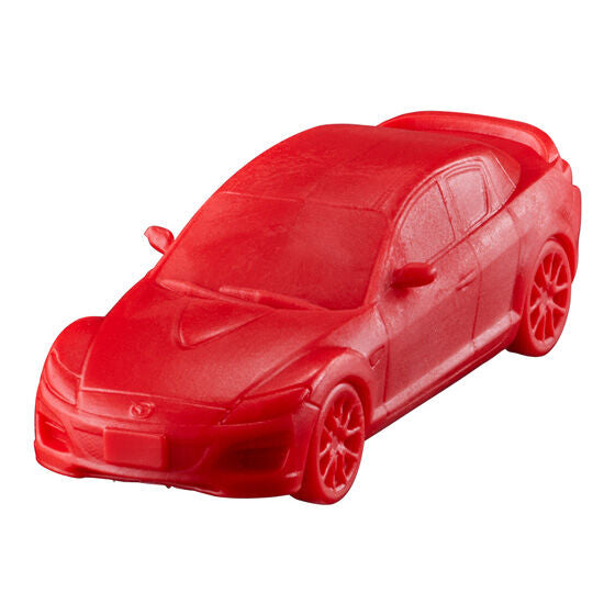 Car Keshi GP MAZDA Selection 01 gashapon, close-up detail of a single capsule toy car